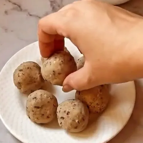 Cala, black-eyed pea fritters, being shaped
