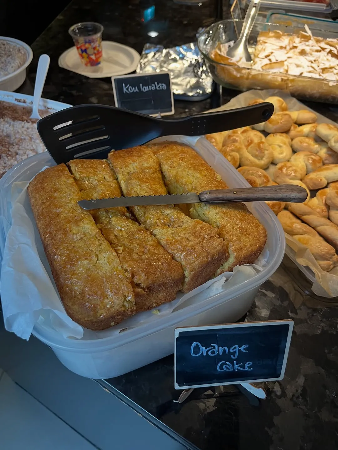Orange cake and koulourakia on the dessert table