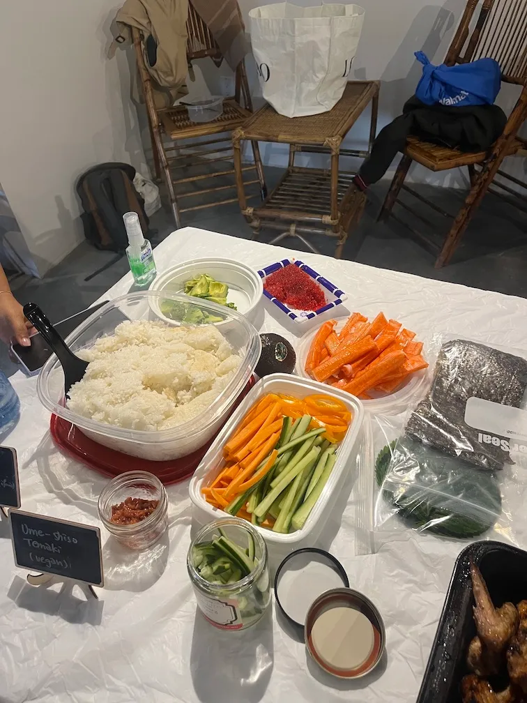A build your own temaki station with sushi rice, cucumber, carrot, shiso and nori, labelled vegan